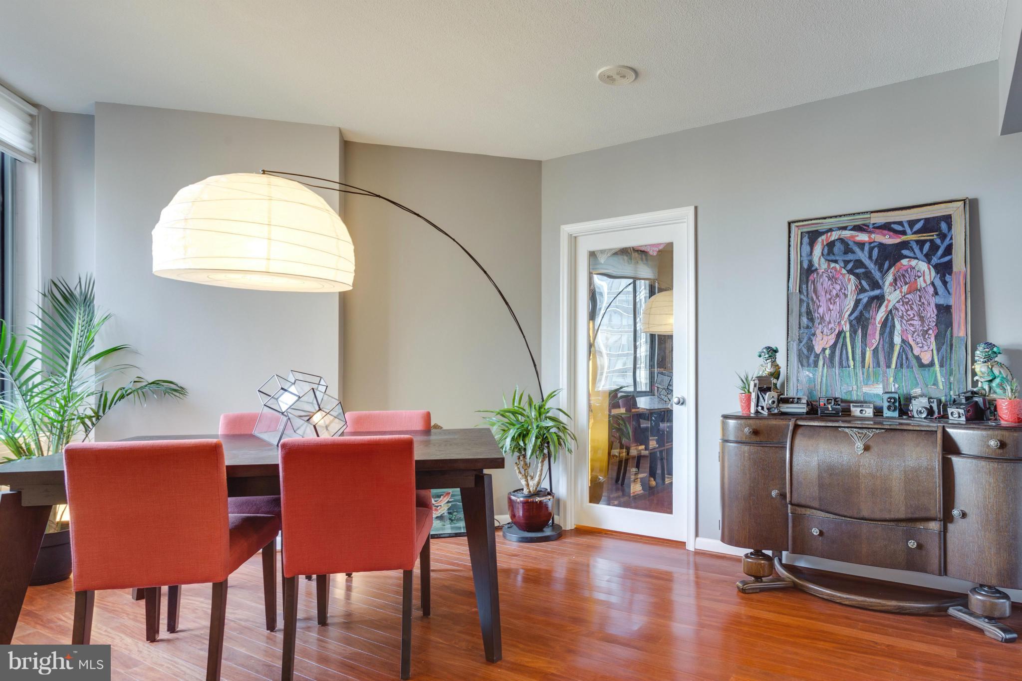 851 North Glebe Road, Unit 501 Arlington, VA 22203 - Photo 11 of 30 a view of a dining room with furniture window and wooden floor