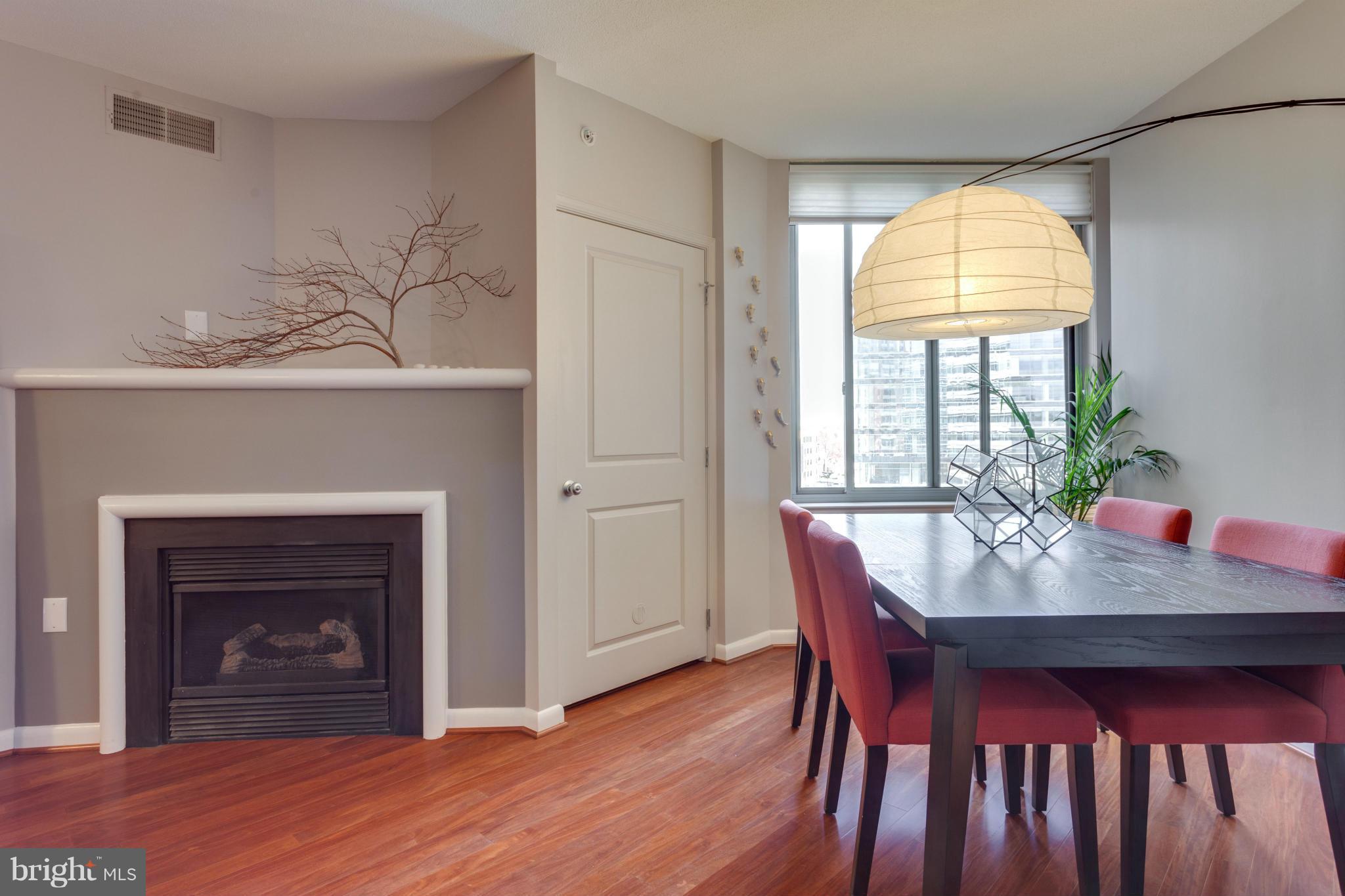 851 North Glebe Road, Unit 501 Arlington, VA 22203 - Photo 12 of 30 a dining room with furniture window and wooden floor