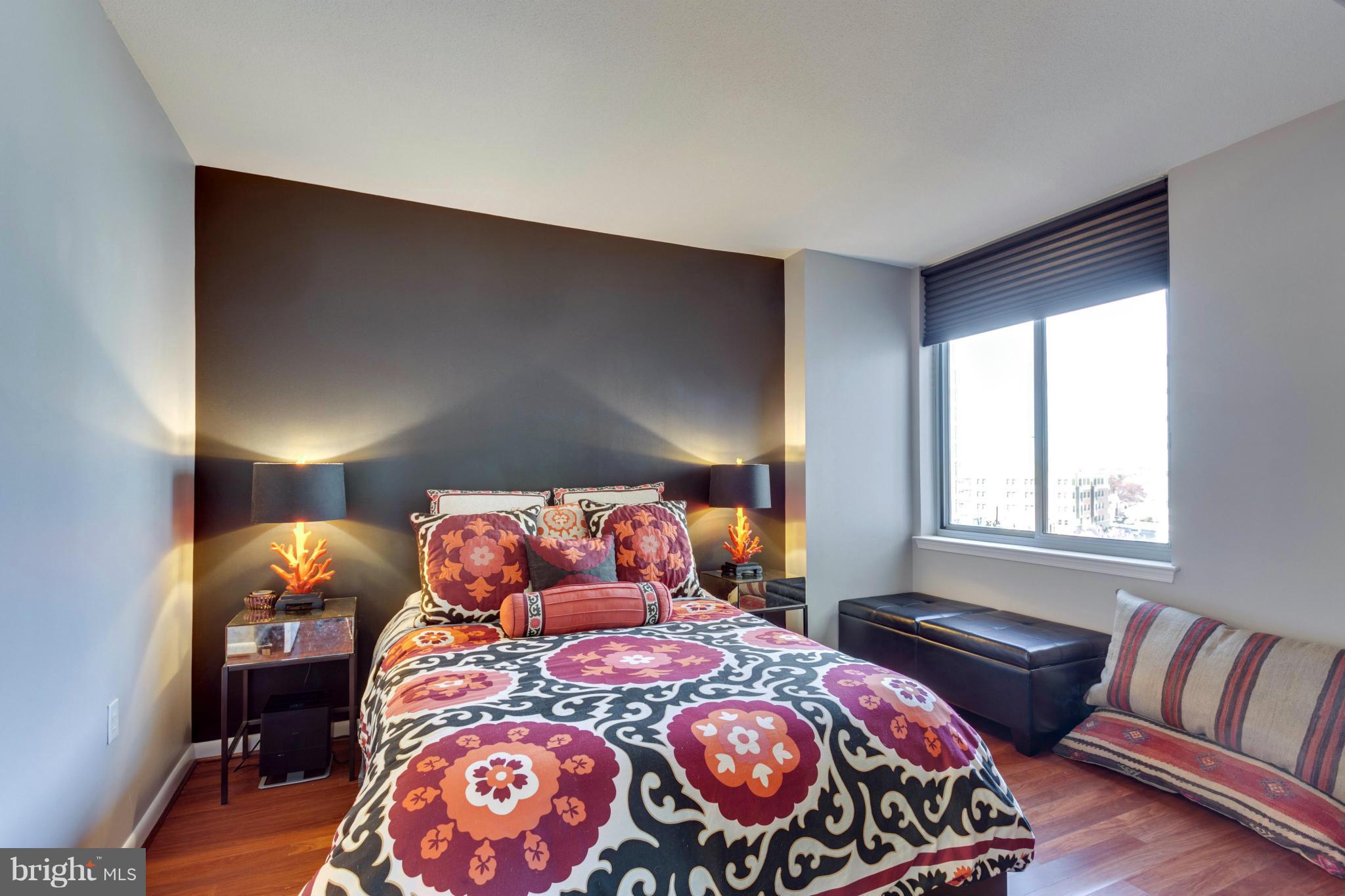 851 North Glebe Road, Unit 501 Arlington, VA 22203 - Photo 14 of 30 a bedroom with a bed and window