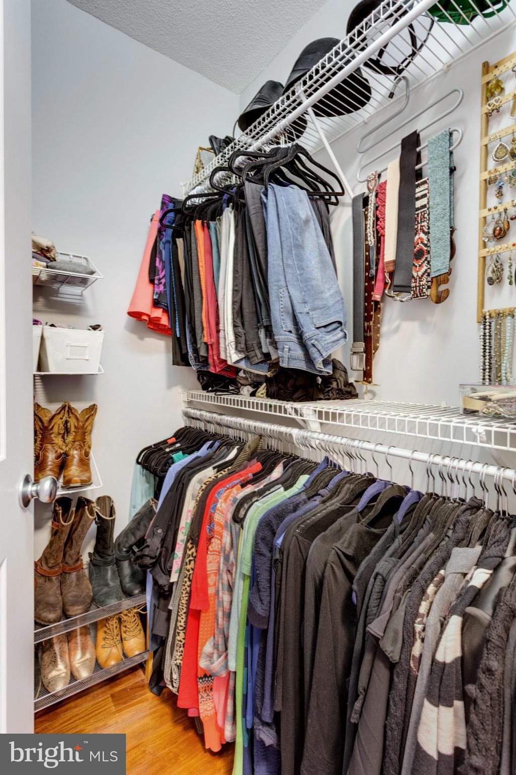 851 North Glebe Road, Unit 501 Arlington, VA 22203 - Photo 17 of 30 a view of walk in closet with clothes and shoes