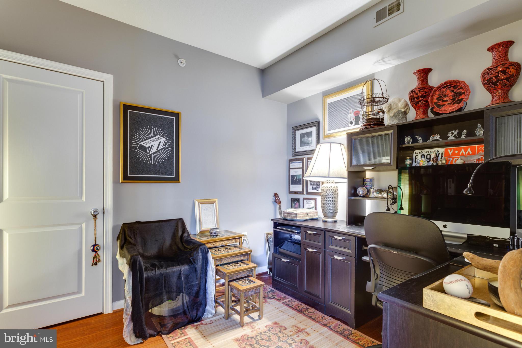 851 North Glebe Road, Unit 501 Arlington, VA 22203 - Photo 19 of 30 a view of a workspace with furniture and a window