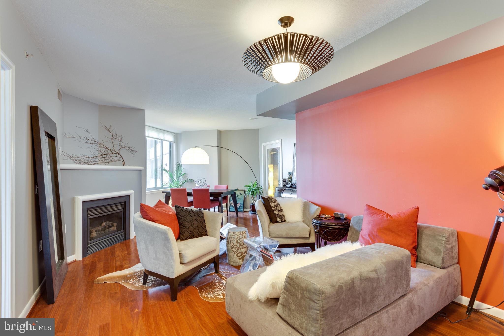 851 North Glebe Road, Unit 501 Arlington, VA 22203 - Photo 5 of 30 a living room with furniture and a fireplace
