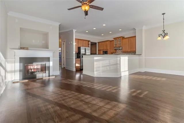 a view of kitchen with cabinets and wooden floor