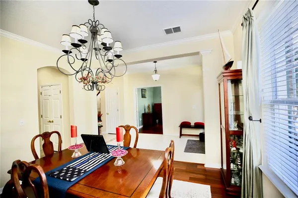 a living room with furniture ceiling fan and a rug
