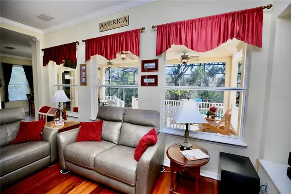 a living room with fireplace furniture and a flat screen tv