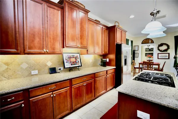 a view of a dining room with furniture and a potted plant