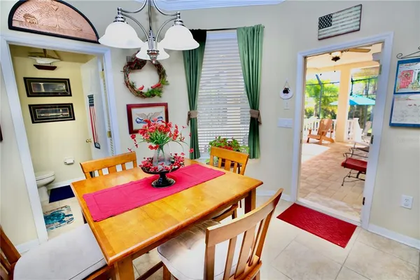 a bedroom with a bed and a flat tv screen on dresser
