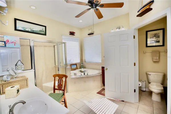 a view of a patio with a table and chairs under an umbrella