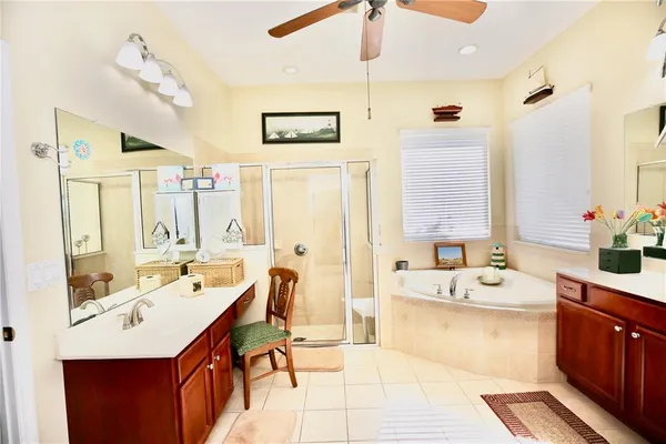 a view of a house with backyard sitting area and garden