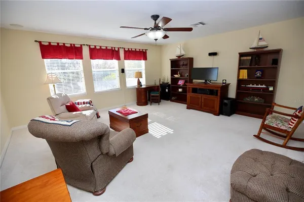 a view of a backyard with sitting area