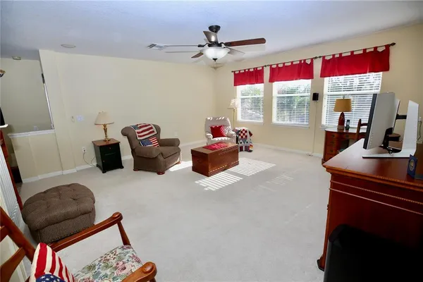 an aerial view of residential house with outdoor space and trees all around
