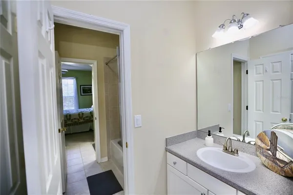 an aerial view of a house with a yard and garden