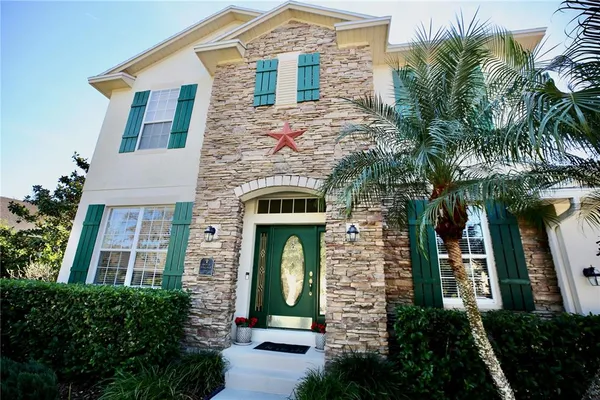 a view of living room with furniture and a mirror