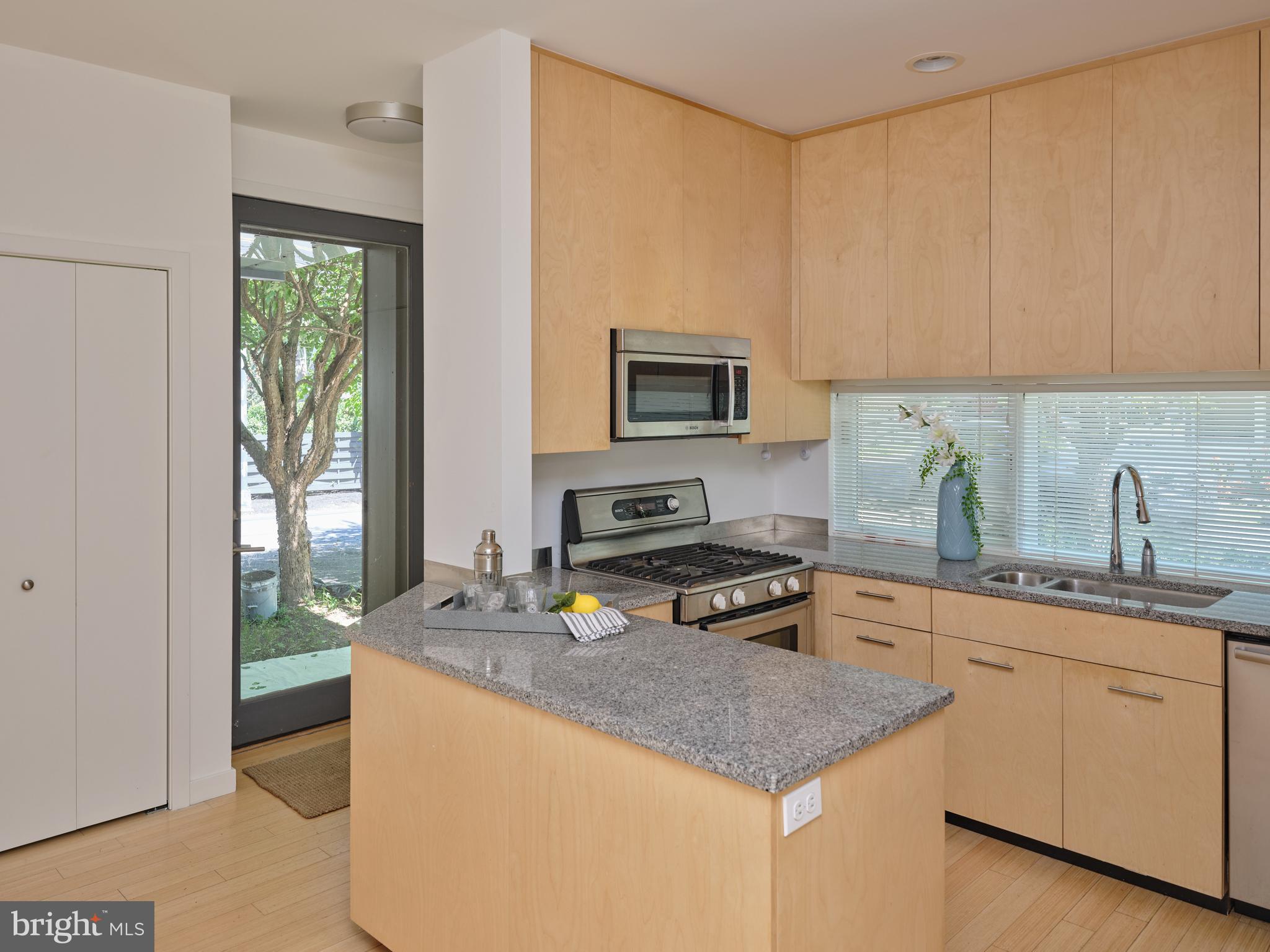 7189 Centerbridge Road New Hope, PA 18938 - Photo 3 of 48 a kitchen with sink a microwave and cabinets