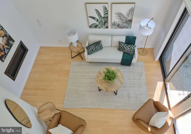 a view of living room with furniture and wooden floor