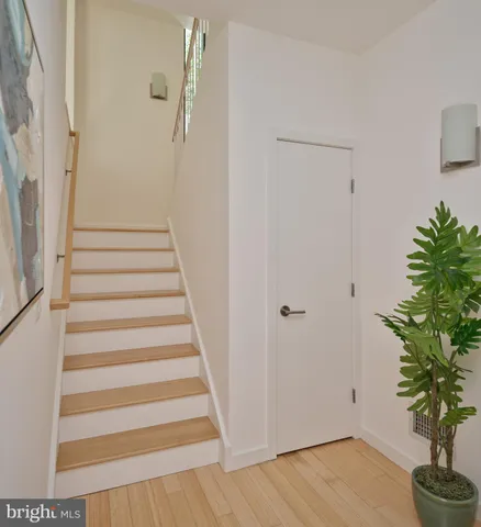 a view of entryway with wooden floor and potted plant