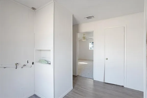 a view of a bathroom with a hardwood floor and a sink