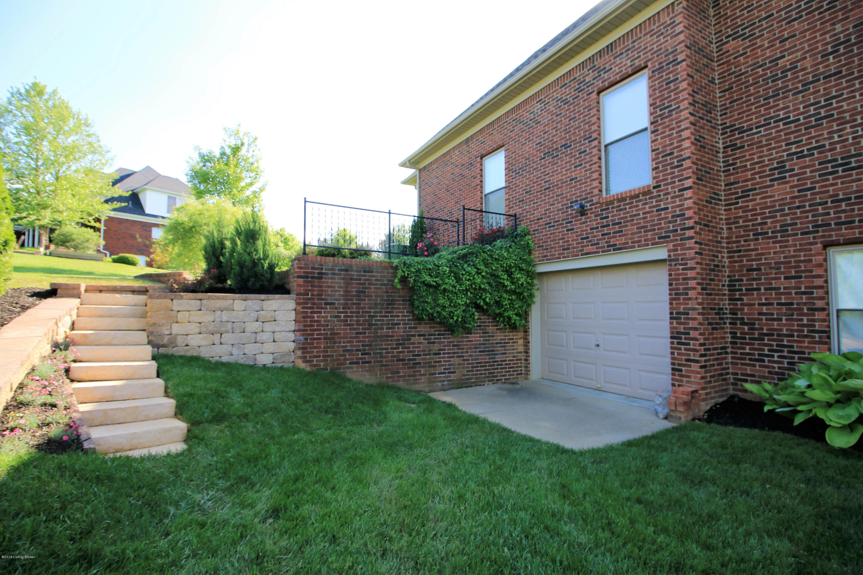 2904 Doe Ridge Court Prospect, KY 40059 - Photo 39 of 86 The space on the side of the home was professionally hardscaped and landscaped to include a retaining wall and attractive staircase.