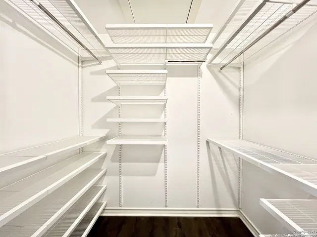 a bathroom with a granite countertop sink toilet a mirror and shower