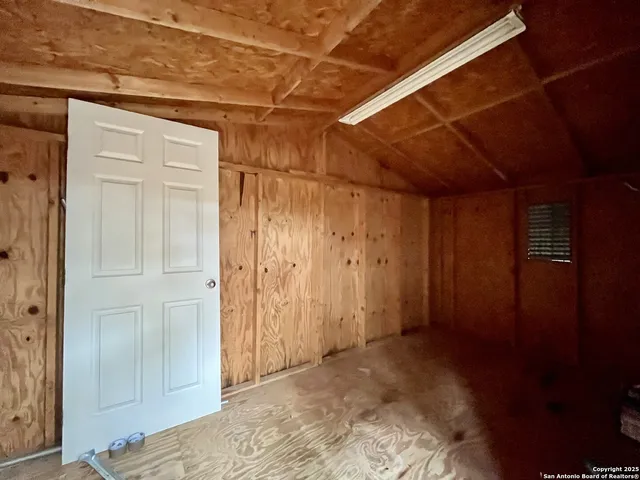 a house that has a tree in front of it