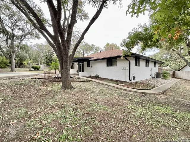 a house with trees in the background