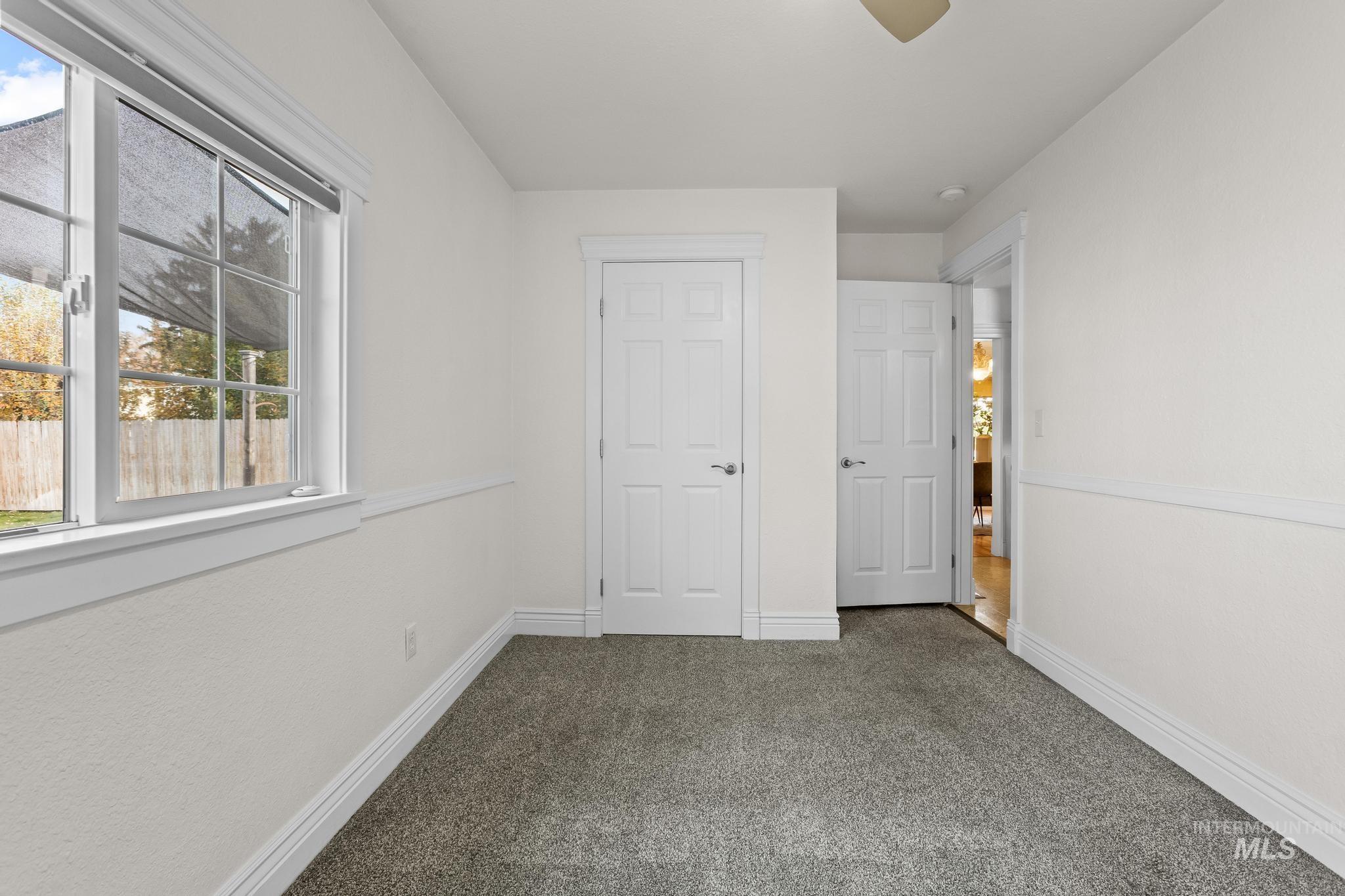 7514 West Swift Lane Boise, ID 83704 - Photo 20 of 46 Unfurnished bedroom featuring carpet floors and a ceiling fan