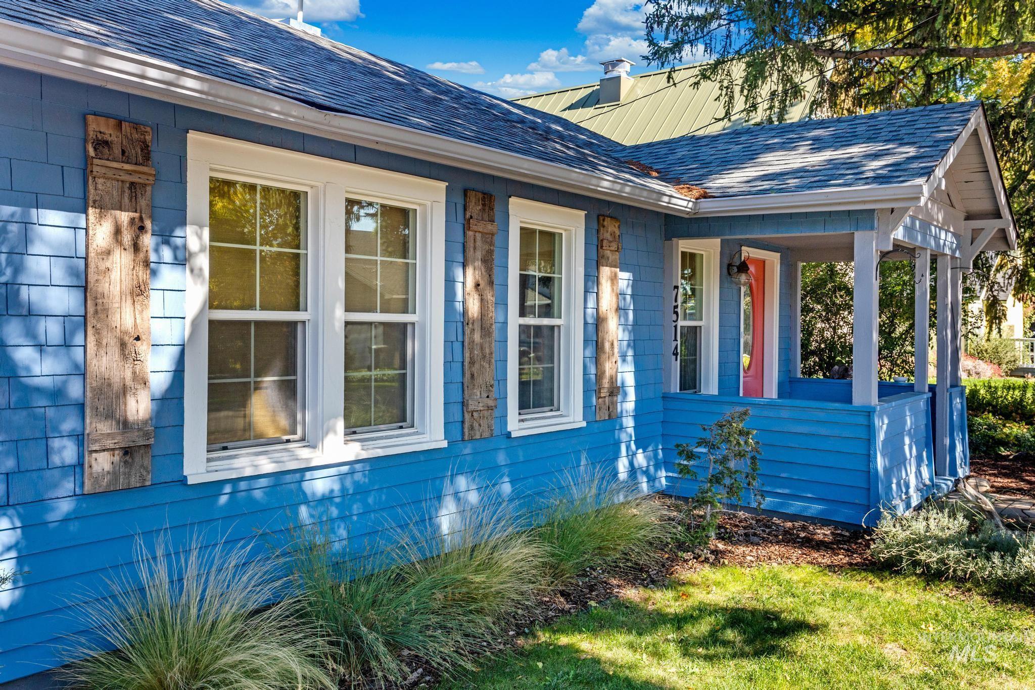7514 West Swift Lane Boise, ID 83704 - Photo 45 of 46 View of home's exterior featuring a porch, roof with shingles, and a chimney