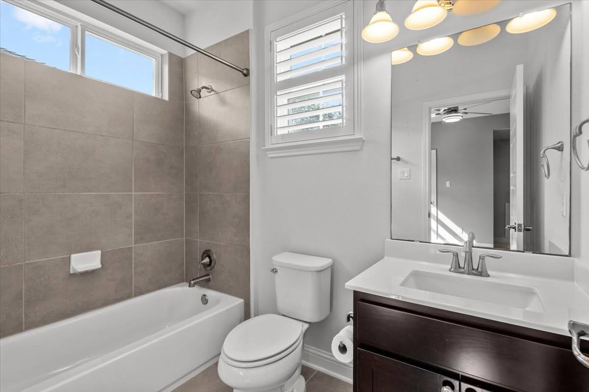 4108 Bison Bend, Unit FOR RENT Cedar Park, TX 78613 - Photo 31 of 36 Full bathroom 4 upstairs. A well-appointed bathroom features a bathtub, toilet, and vanity with ample storage and overhead lighting.