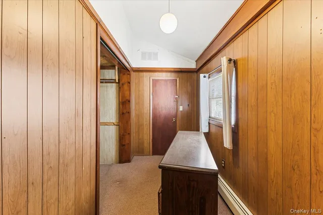 a view of entryway with a wooden door