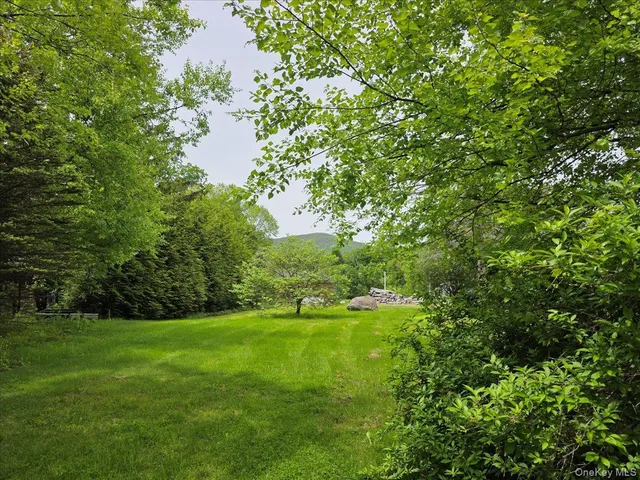 a view of swimming pool is middle in the green field