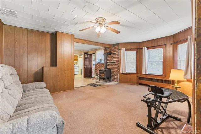 a view of a livingroom with furniture and windows