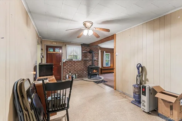 a view of a livingroom with furniture and a flat screen tv