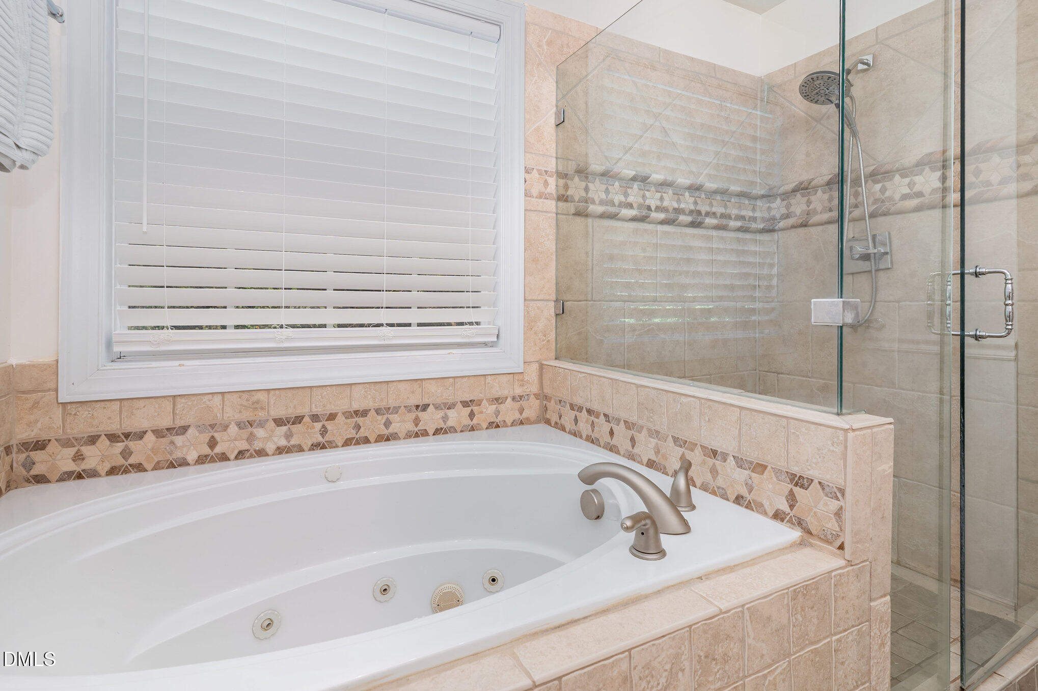 4613 Cherrybark Lane Raleigh, NC 27616 - Photo 15 of 27 a bathroom with bathtub and shower