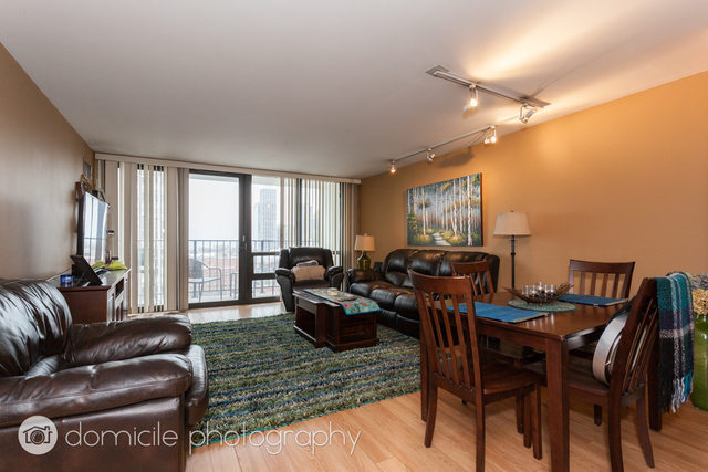 Undisclosed Address Chicago, IL 60614 - Photo 2 of 12 a living room with furniture and a large window