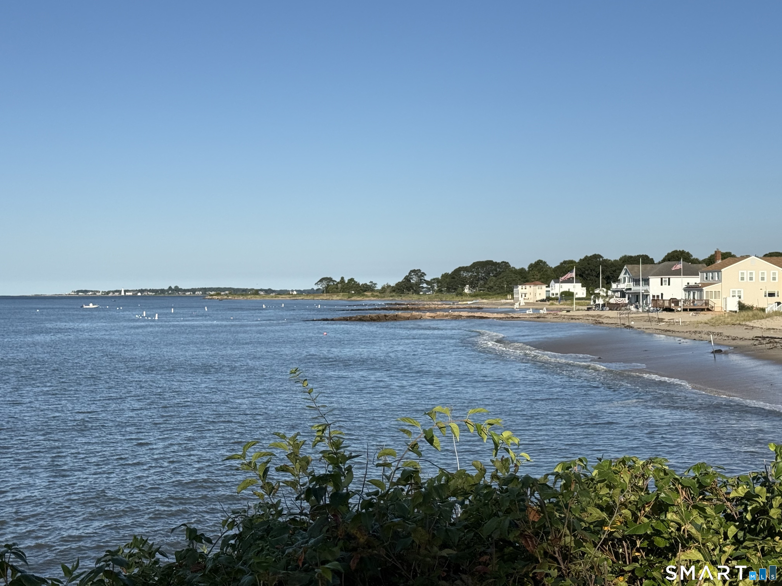 16 Springfield Road Old Lyme, CT 06371 - Photo 4 of 19 a view of an ocean with beach