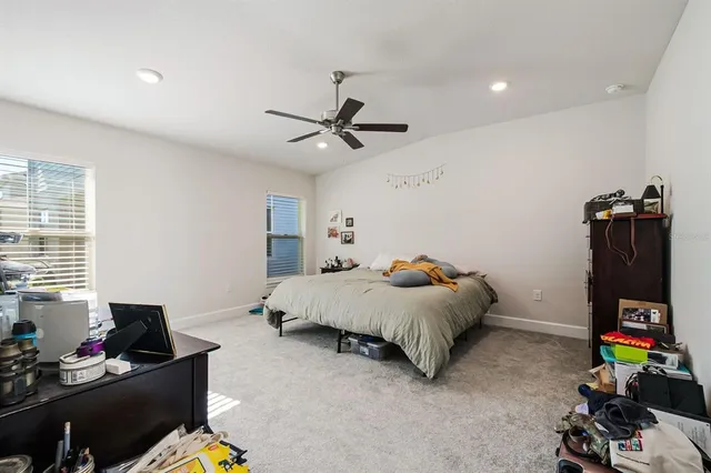 a bed room with furniture and a window