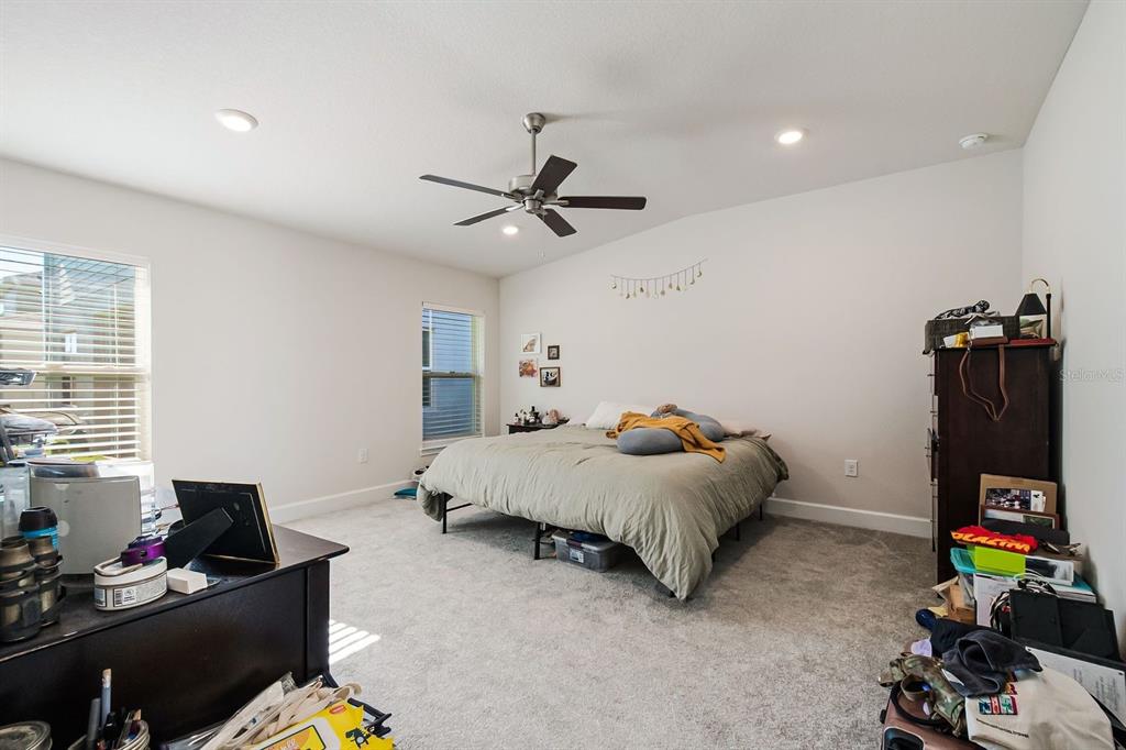 3711 Sagefield Drive Harmony, FL 34773 - Photo 13 of 18 a bed room with furniture and a window