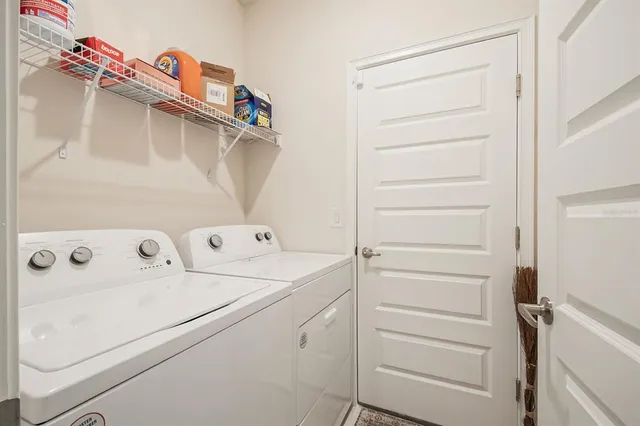 a utility room with dryer and washer