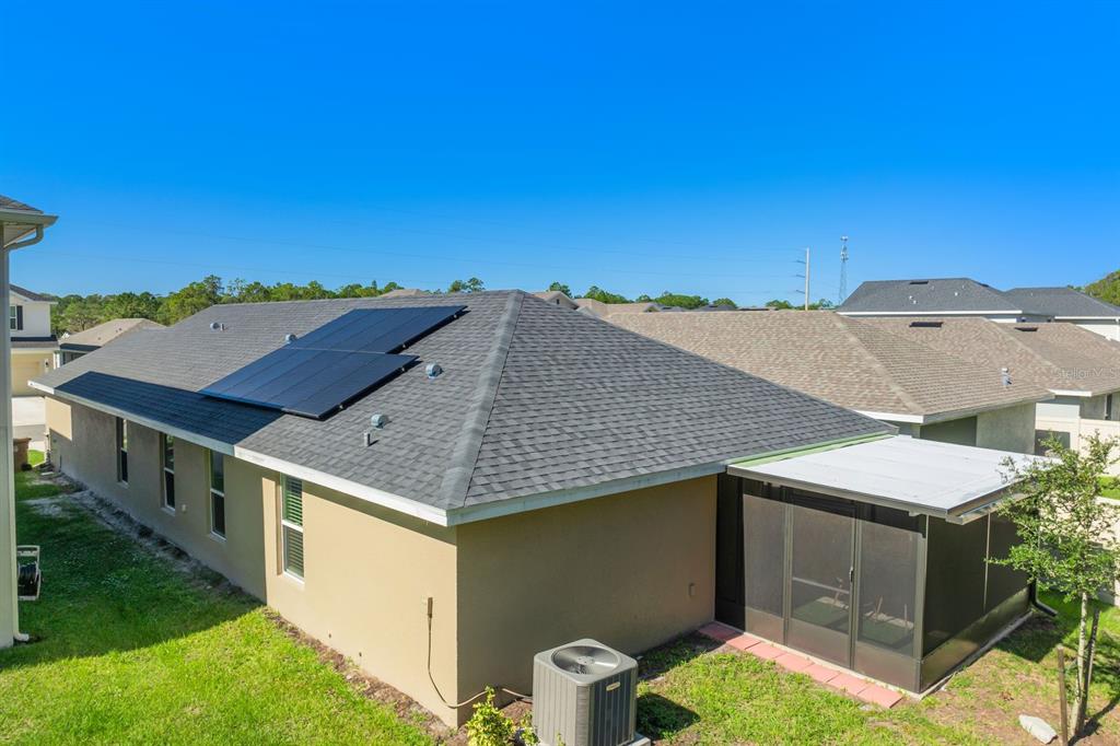 3711 Sagefield Drive Harmony, FL 34773 - Photo 17 of 18 a aerial view of a house with a yard and balcony