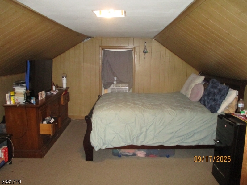7 Kossuth Street Newark, NJ 07105 - Photo 15 of 18 a bedroom with a bed and a mirror