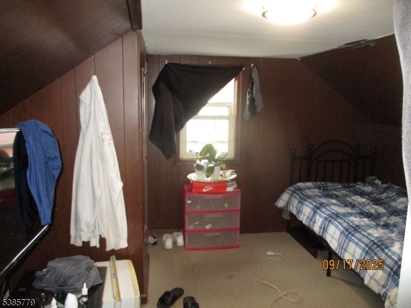 7 Kossuth Street Newark, NJ 07105 - Photo 16 of 18 a bedroom with a bed and a dresser