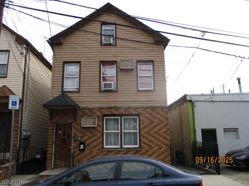 7 Kossuth Street Newark, NJ 07105 - Photo 2 of 18 a front view of a house with parking