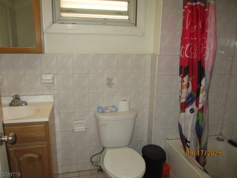 7 Kossuth Street Newark, NJ 07105 - Photo 7 of 18 a bathroom with a toilet and a sink