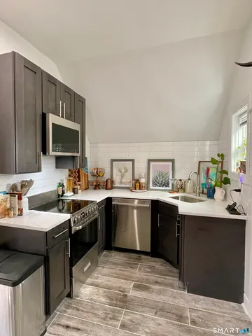 a kitchen with a sink and cabinets