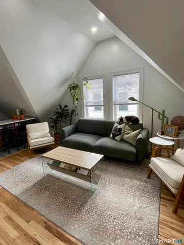 a living room with furniture and a rug