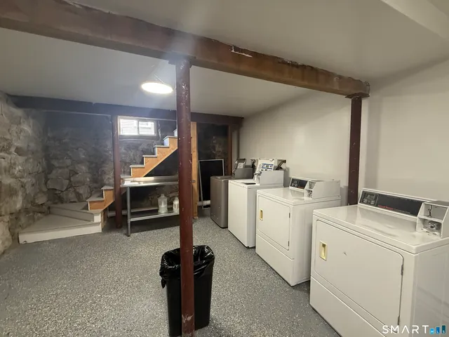 a view of storage and utility room with washer and dryer