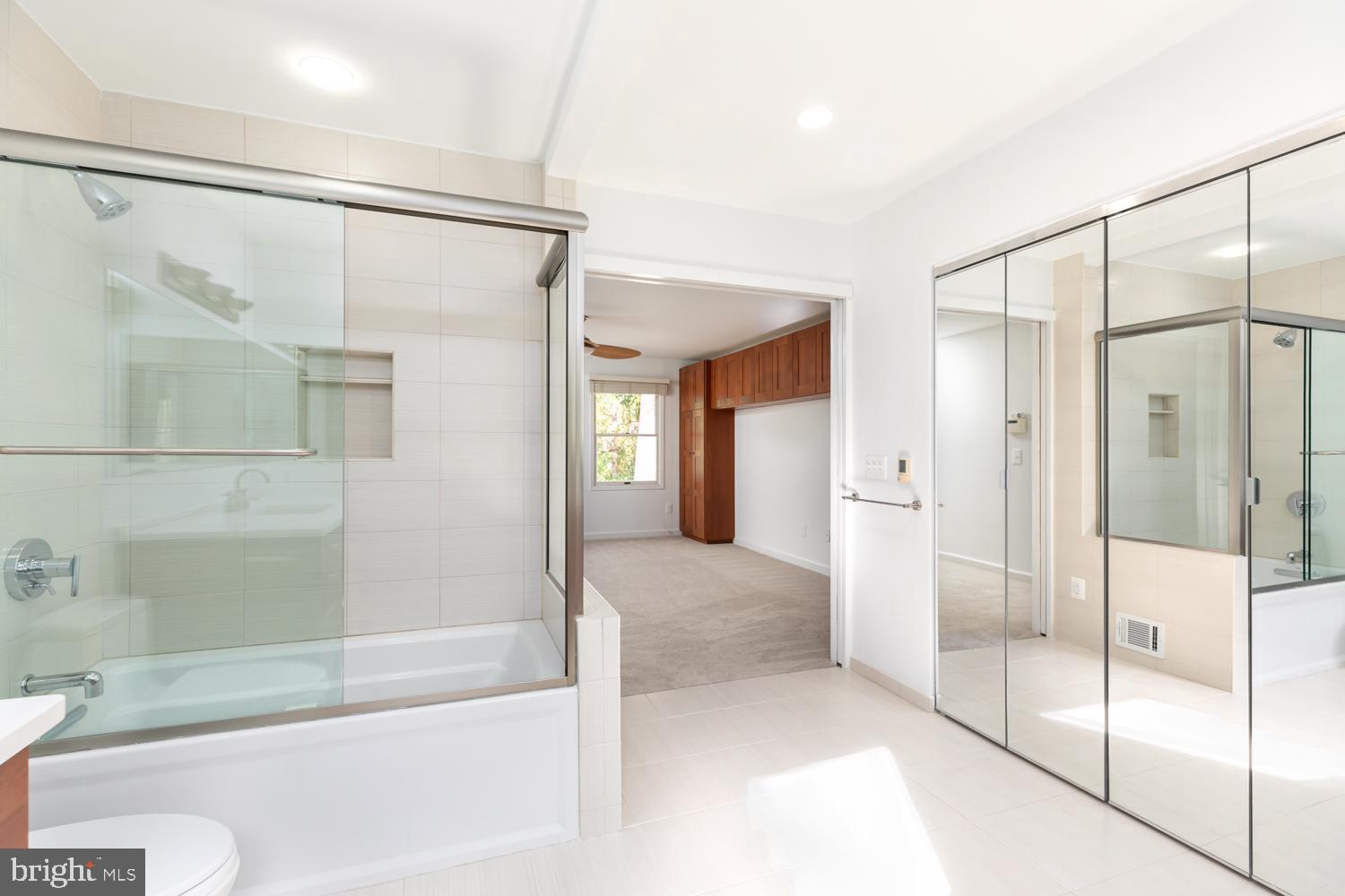 11603 Deer Forest Road Reston, VA 20194 - Photo 19 of 38 a bathroom with a glass shower door and a sink
