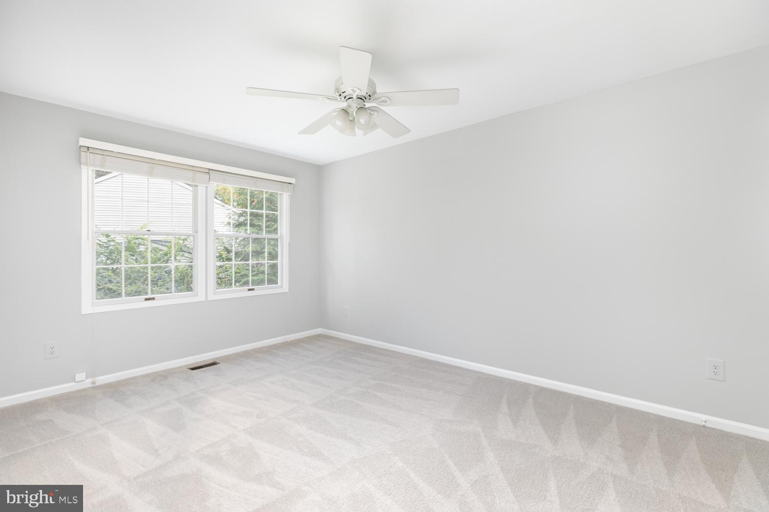 11603 Deer Forest Road Reston, VA 20194 - Photo 24 of 38 an empty room with a window and a fan