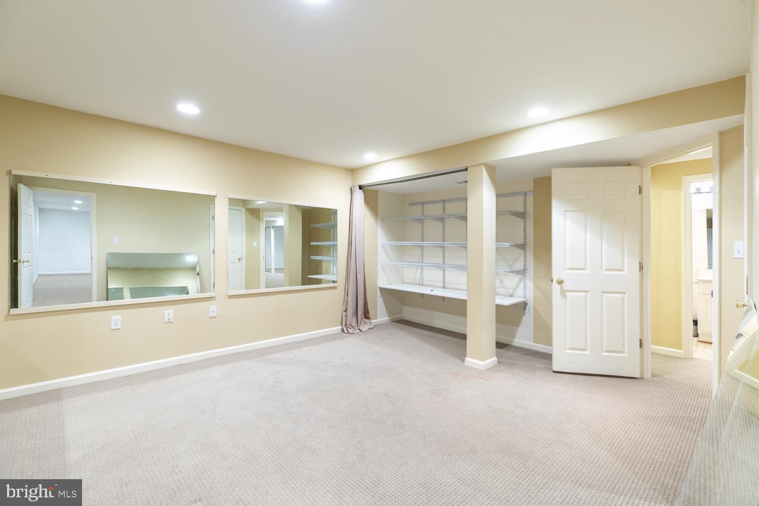 11603 Deer Forest Road Reston, VA 20194 - Photo 27 of 38 a view of an empty room with wooden floor and a window