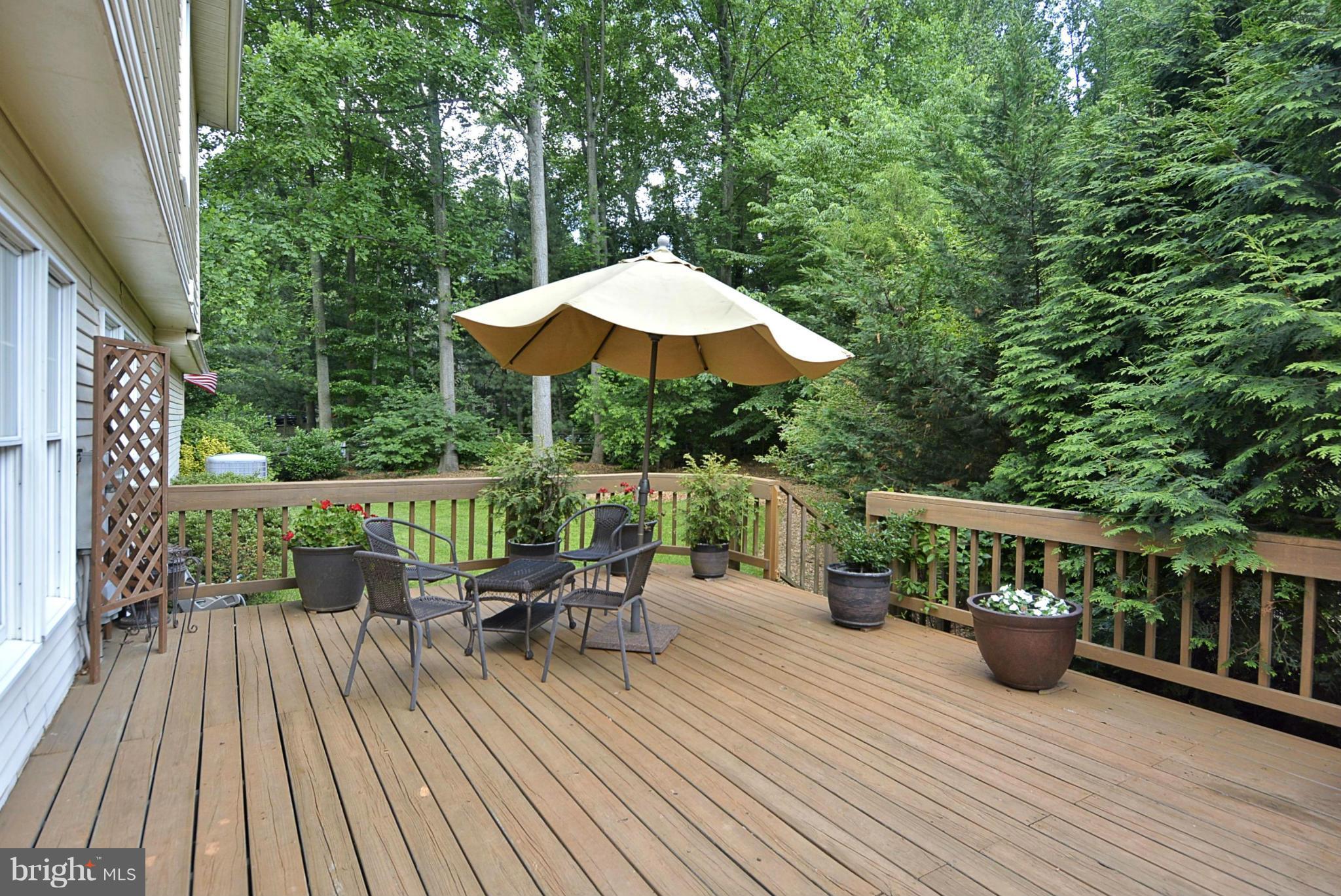 11603 Deer Forest Road Reston, VA 20194 - Photo 34 of 38 a view of balcony with outdoor seating and wooden floor
